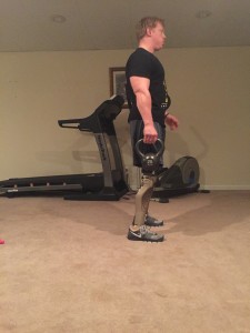 Finally, standing straight up, pushing the hips forward (squeezing the buttcheeks together) - and locking the knees. Posture is upright, looking forward.